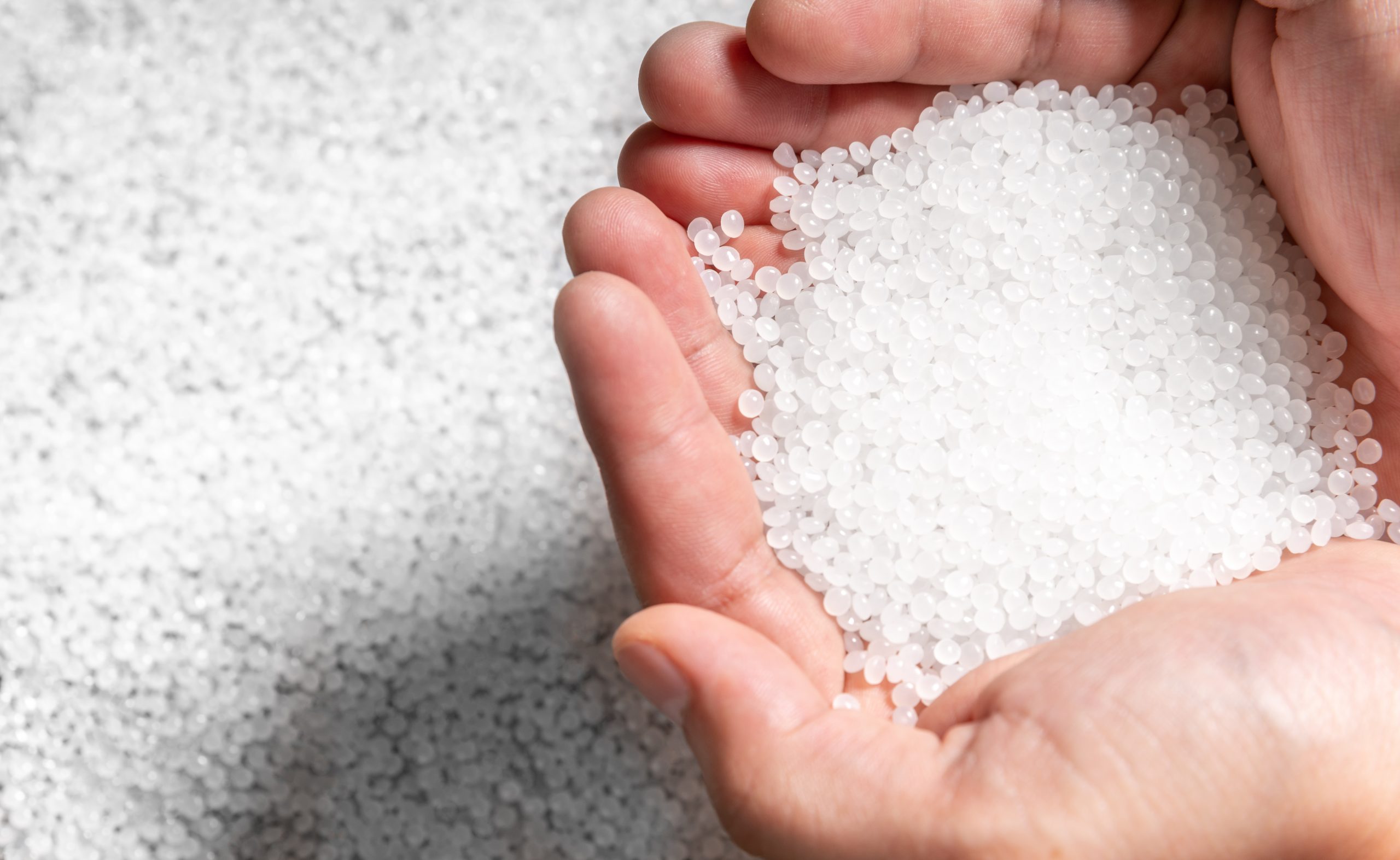 engineer hold white plastic on hand polymer petrochemical produc